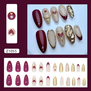 Deep red heart pearls press-on nails with golden ripples and 3D textured accents