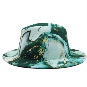 Detail of green and white marble pattern wool fedora hat with elegant gold flake accents