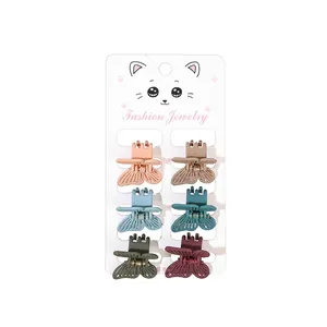 Set of 6 colorful matte butterfly hair claws with hollow design on display card