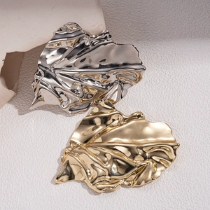 Metallic irregular leaf brooches with pleated texture in gold and silver finishes
