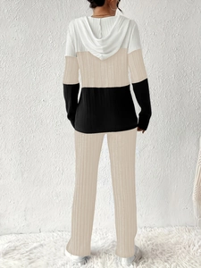 Detailed back view of two-piece hooded tracksuit featuring ribbed texture and color blocking