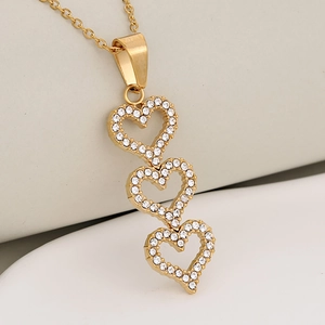 Luxury gold heart pendant necklace featuring sparkling white crystals in a triple heart design