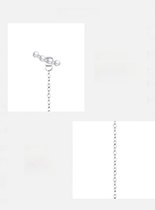 Macro detail of 925 sterling silver long chain earrings with round white pearls