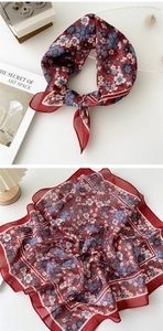 Detail showing the red floral cotton linen square scarf with vintage art print and fine edges