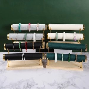 Detail of multi-tier jewelry displays with solid wood base and velvet rolls for bracelets