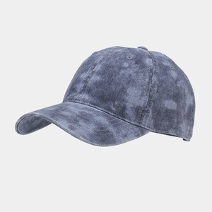 Close-up of gray-blue washed cotton baseball cap showing vintage texture and stitching