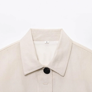 Front close-up of beige lapel cotton linen short jacket with single-breasted buttons