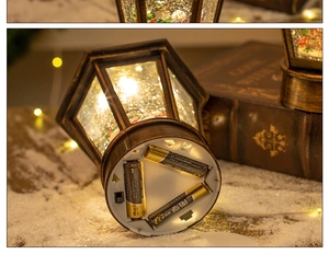 Detail view of the battery compartment and water glitter effect inside a vintage lantern
