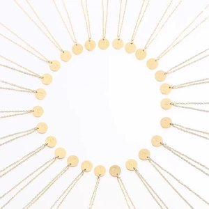 Collection of gold 18k plated stainless steel necklaces with round letter pendants