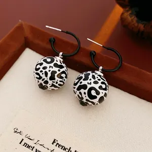 Vintage leopard print round dangle earrings with elegant black metal hoops for women