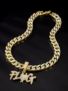 Close-up of gold plated Cuban chain and FLAG pendant with sparkling pavé rhinestones
