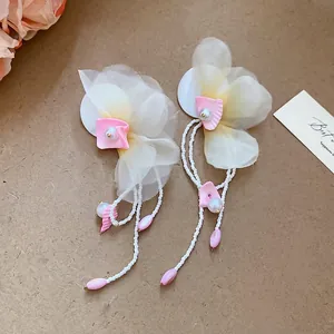 Elegant floral earrings with white chiffon petals and long beaded pearl tassels