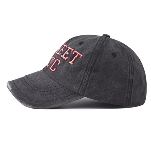 Detail of vintage washed charcoal cotton baseball cap with red Street NYC embroidery