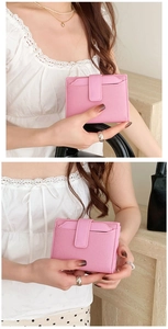 Detailed close-up showing pink PU leather wallet texture and its compact bifold side profile