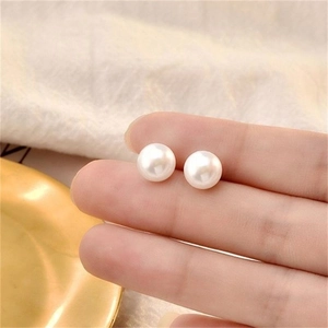 Elegant pair of 8mm natural freshwater white pearl stud earrings in a minimalist design