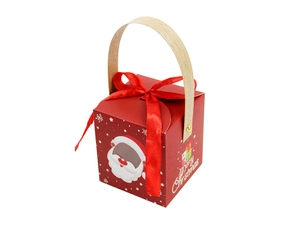 Detail of red Christmas gift box with wooden handle, ribbon and Santa Claus pattern