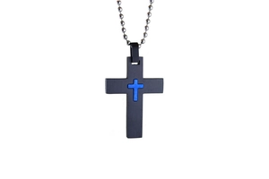 Detail of a punk style black cross pendant with a blue inlay on a silver bead chain