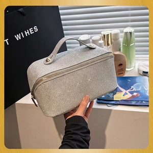 Sparkly silver glitter cosmetic bag with top handle and large capacity for toiletries