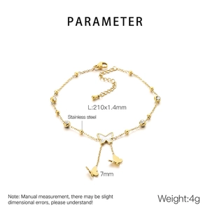 Detail of 18K gold plated stainless steel anklet showing double layer and butterfly charms
