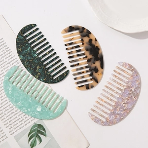 Chic acetate geometric wide-tooth combs in marble and tortoiseshell patterns