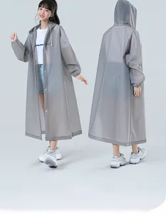 Detail view of a gray translucent EVA raincoat featuring a drawstring hood and snap buttons