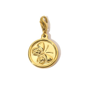 Close-up of golden butterfly relief charm on a round disk with lobster clasp detail