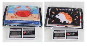 Detail of soft fabric baby book set weighing 135g with colorful animal patterns