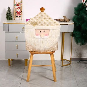 Detail of Santa Claus chair cover with gold snowflake print and white plush beard trim