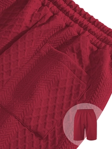 Detail of dark red waffle texture fabric and elastic drawstring waistband on casual shorts