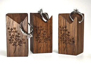 Black walnut and brass ring display stands with tree branch engraving for jewelry store