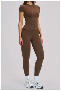 Close-up of high-waist yoga leggings and slim-fit top in dark brown quick-dry fabric