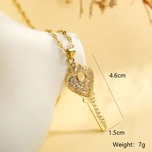 Detail view of heart-shaped key pendant showing 4.6cm length and 1.5cm width dimensions