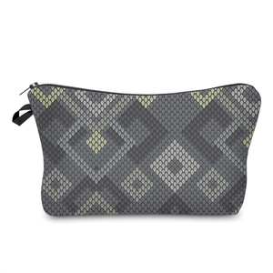 Detailed macro view of the grey snakeskin pattern on a professional vanity makeup bag