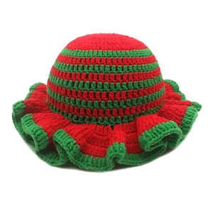 Handmade crochet ruffle hat with festive red and green stripes in a knitted wavy design