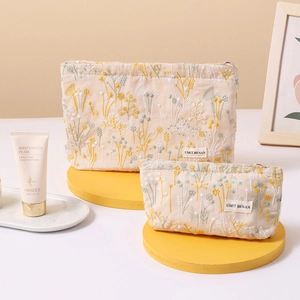 Floral embroidered linen cosmetic bag set including two sizes with metal ring zipper
