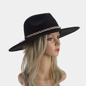 Detail of black wide brim fedora with ethnic beaded band and turquoise accents