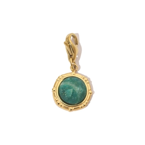 Close-up of vintage gold lobster clasp with a faceted green natural stone pendant