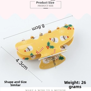 Detailed dimensions of yellow Christmas hair claw clip with snowman and candy patterns