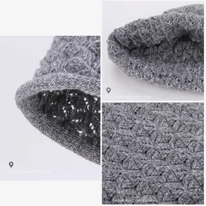 Grey knit beanie with rolled brim and soft thermal lining for winter warmth and style