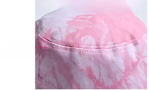 Detailed close-up of pink tie-dye fabric and stitching on a sun protection bucket hat