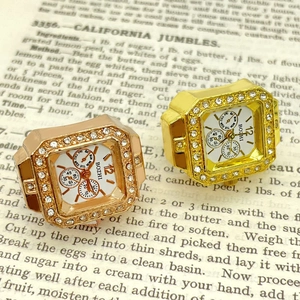 Square quartz ring watch with diamond-encrusted bezel in gold and rose gold finish