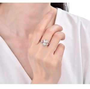 Detail of adjustable 925 sterling silver cat ring worn on a finger for size reference