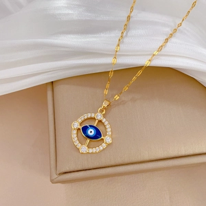 Elegant gold titanium evil eye pendant necklace with blue eye and sparkling cubic zirconia