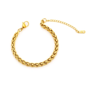Detail of golden wheat chain bracelet featuring lobster clasp and adjustable steel tag