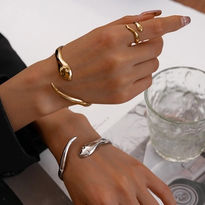 Two-piece polished snake-shaped open bracelets set in gold and silver finish for women