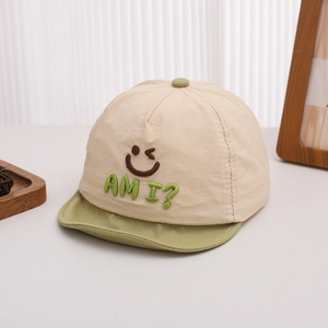 Detail showing embroidered smiley face and colorful brim on soft quick-dry baby sun hat