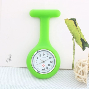 Macro detail of green silicone nurse pocket watch with quartz movement and cross icon