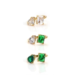 Close-up of stacking 18k gold plated open rings with pear and emerald cut crystals