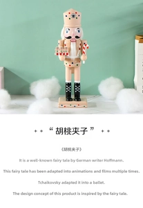 Detailed close-up of 25cm pink gingerbread nutcracker doll with ornate festive hand painting