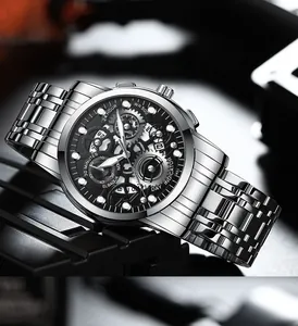 Macro shot of silver stainless steel strap and skeleton dial with exposed mechanical gears